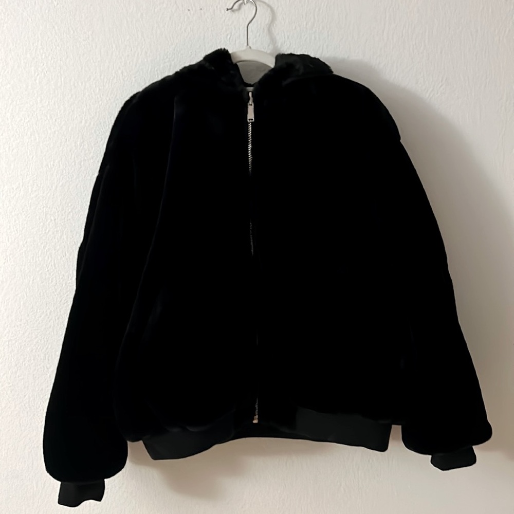 Faux Fur reversible black hooded bomber.